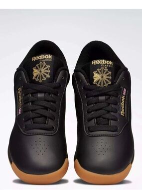 Reebok Princess Women’s Sneaker in Black with Gold Accents; NWOB, Sz. 8.5